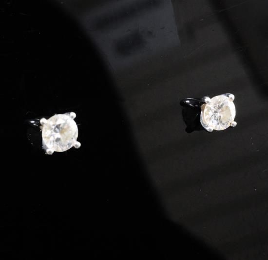 A pair of 18ct white gold and solitaire diamond ear studs.
